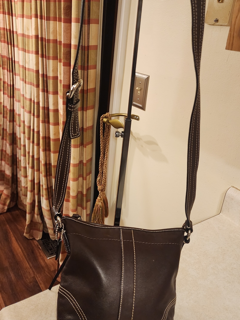 brown leather Coach SoHo small crossbody shoulder bag. 
